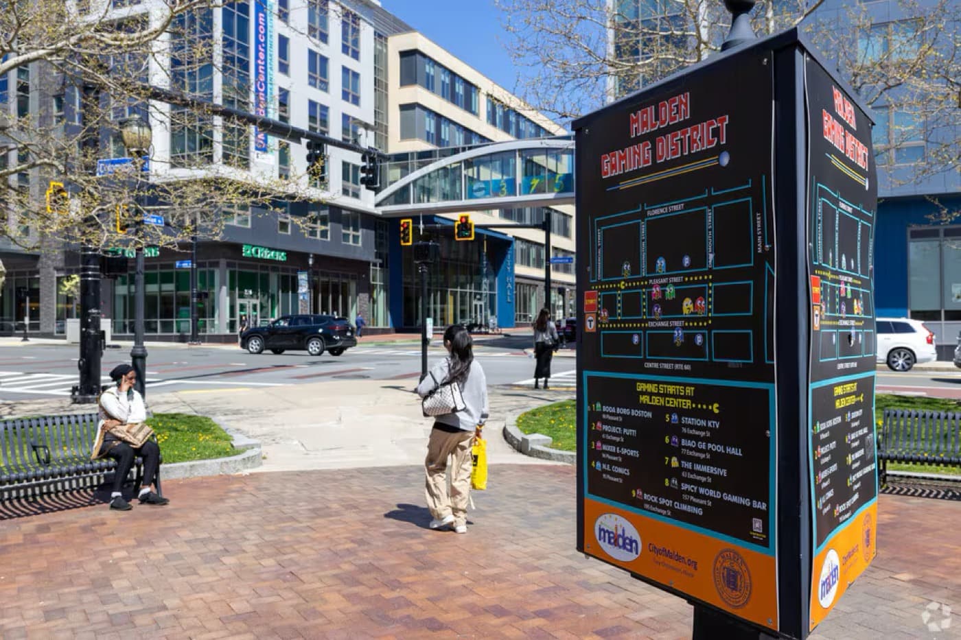 Downtown Malden's pedestrian plaza, with a Malden Dining District map sign